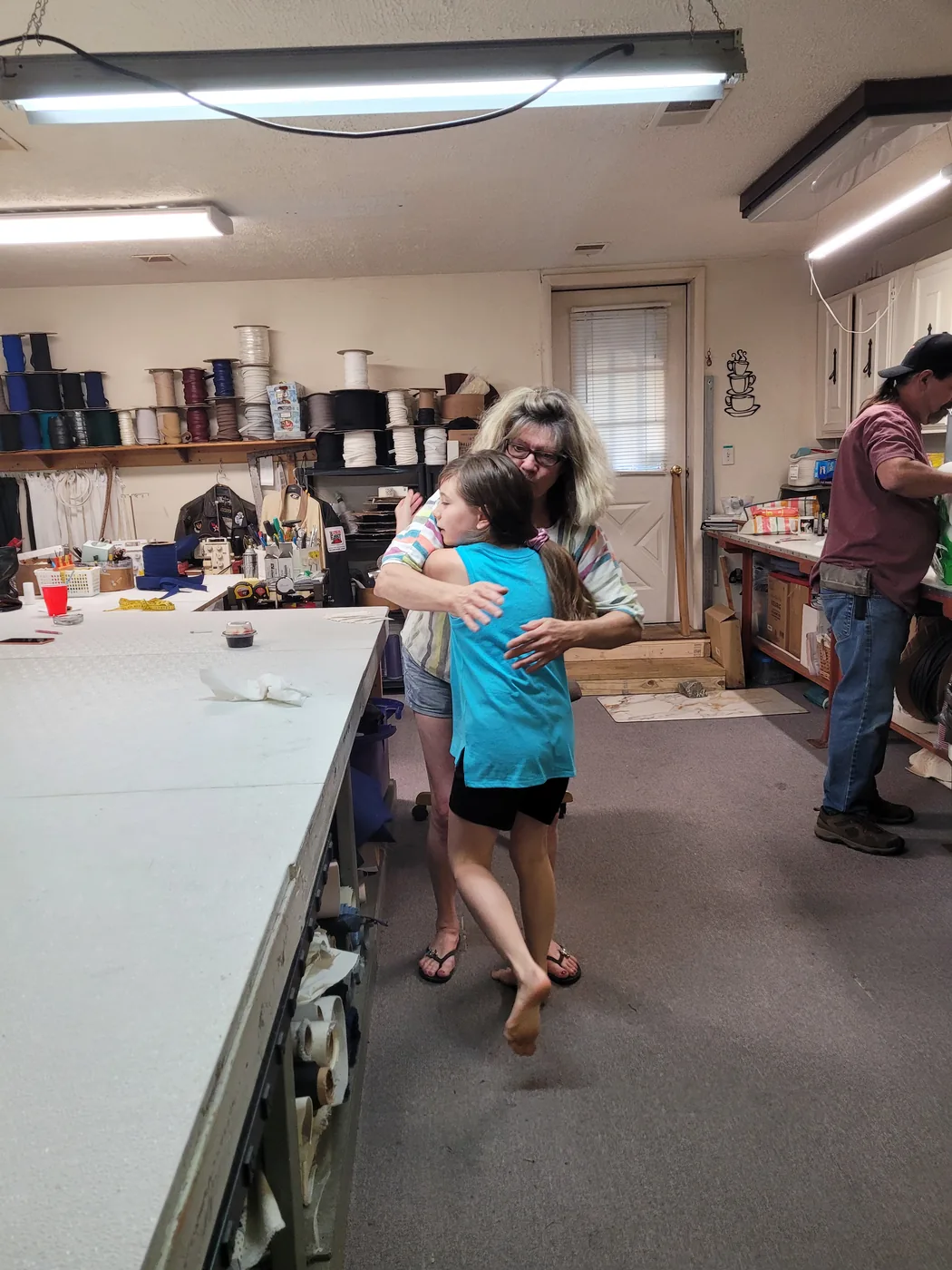 Grandchildren learning about sewing